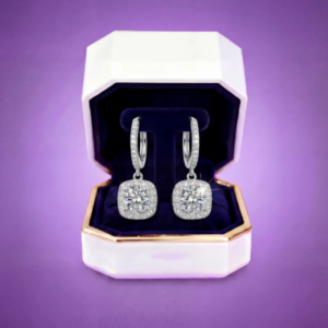 Moissanite drop earrings showcased in a premium jewelry box with deep velvet interior.